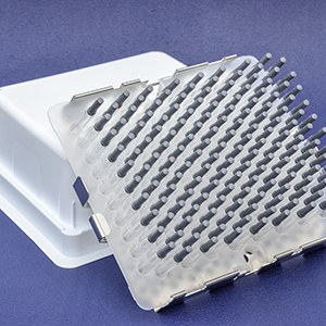 A picture of a sterilization Stericover stainless-steel tray turned upside down with 160 nested syringes securely held in place